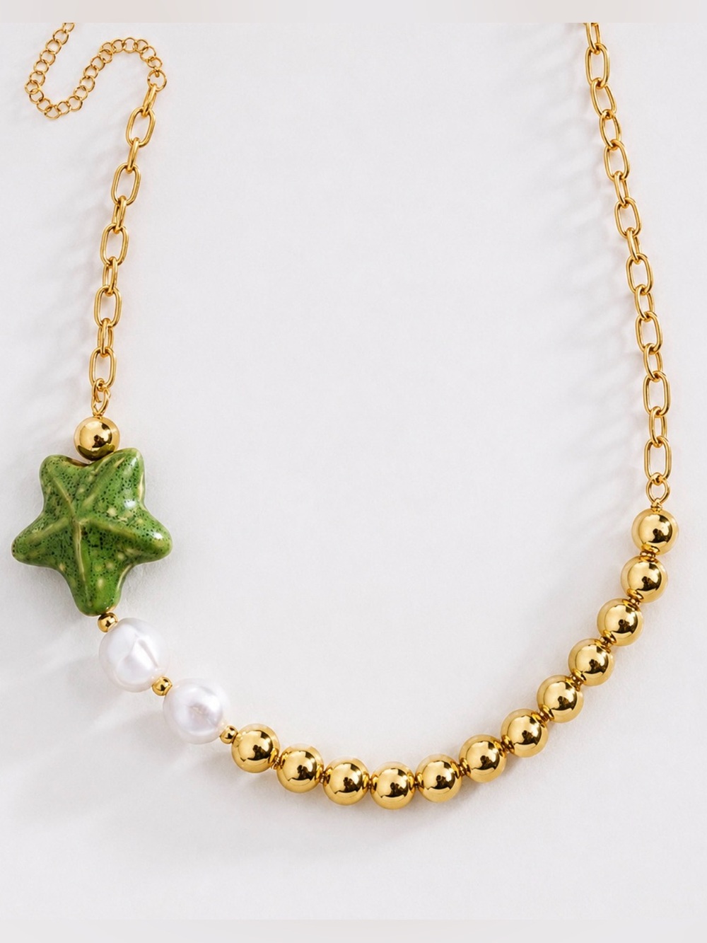 Gold Beaded Necklace with Green Star Pendant and Pearl Accents